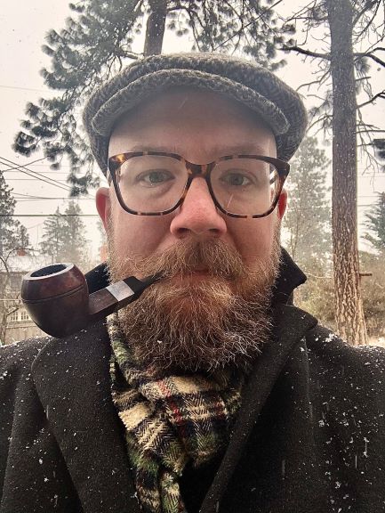 man in hat, glasses, scarf, pipe