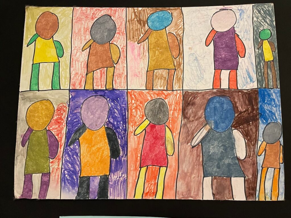 multi-colored people drawing in crayon