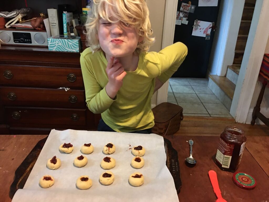 child-baking-jam-thumbprint-cookies