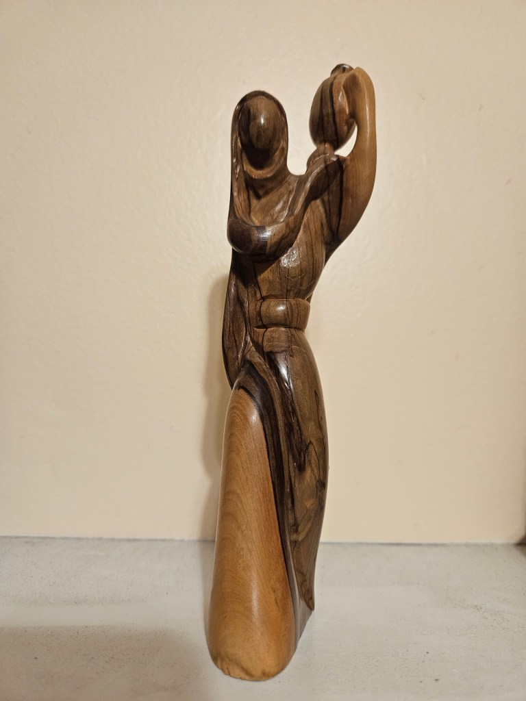 wooden-sculpture-woman-holding-jug